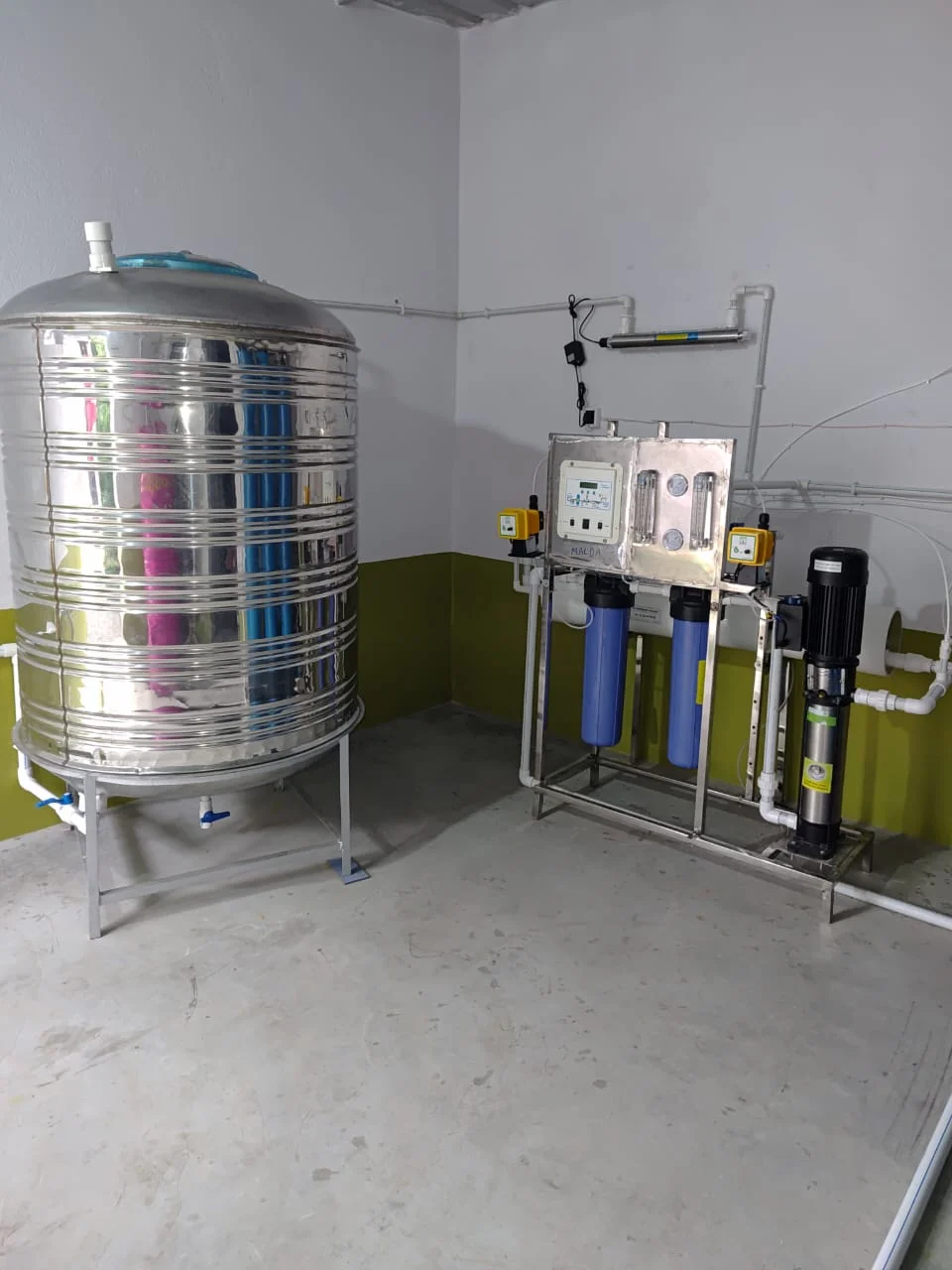 Commercial water plant with storage tank